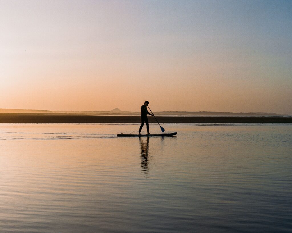 Paddle Boarder on The Beach